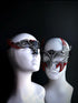 Elegant red and silver matching masquerade masks for couples featuring dramatic winged detail