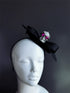 Halloween skull fascinator hat with black bow and rhinestone skull detail.