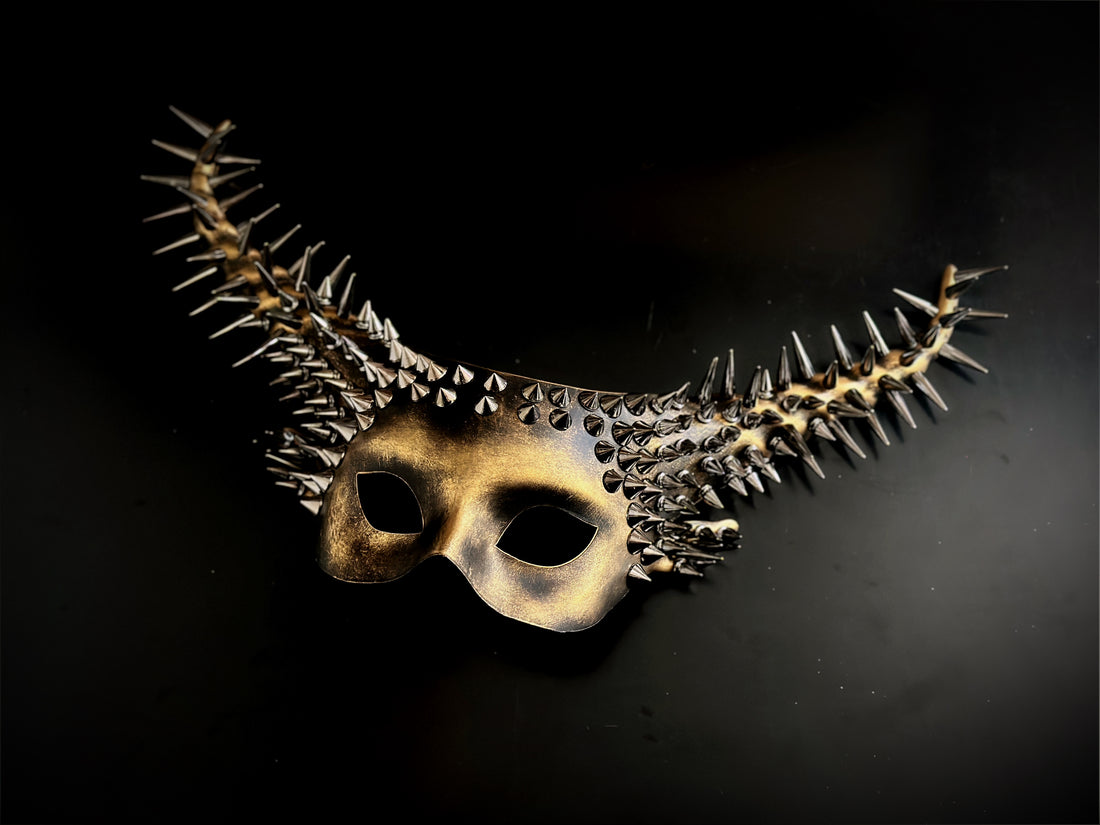 Gold gothic horn masquerade mask with spikes and studs, designed for Halloween, cosplay, and gothic masquerade parties.