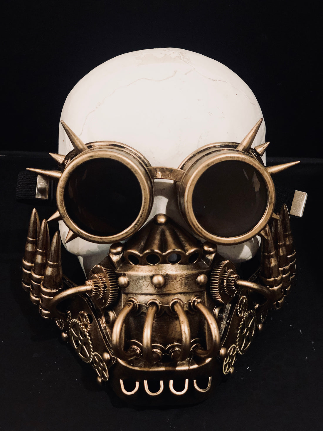 Set of steampunk goggles and respirator mouth guard in gold for sale.