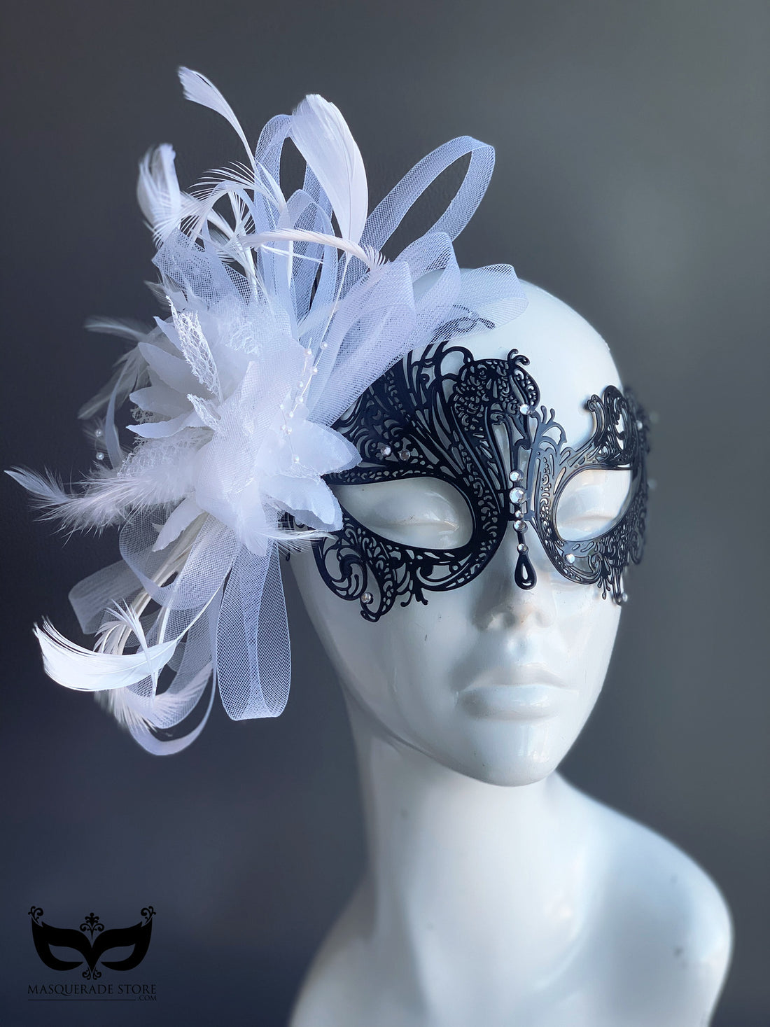 Elegant swan-inspired masquerade mask with feathers and lace