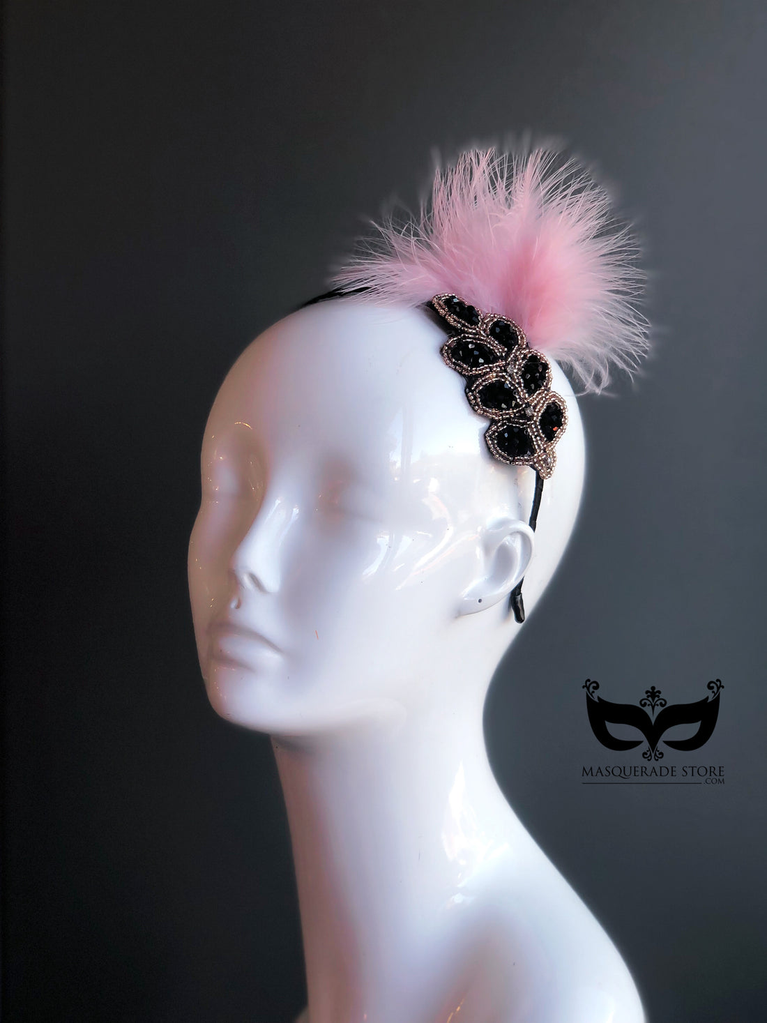 Pink feather fascinator hat with black beaded applique, elegant headpiece for weddings, races, and tea parties.