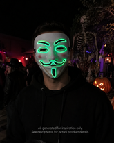 Green Voltage LED light-up mask with glowing green eye, brow, smile, mustache, and chin details, replaceable battery, and three lighting settings.