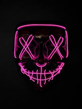 Pink Voltage LED light-up mask with glowing pink X eyes, stitched smile design, full-face shape, replaceable battery, and three lighting settings.