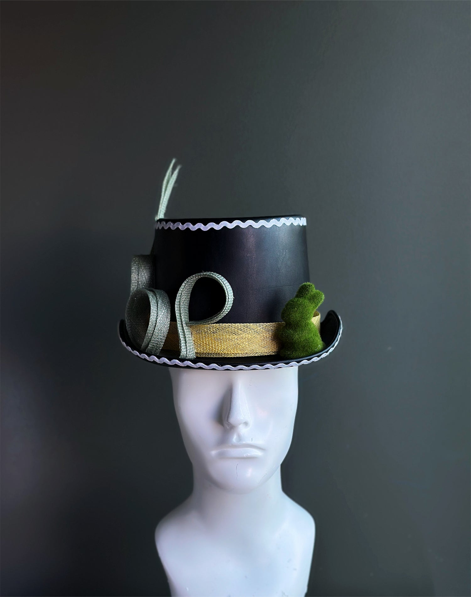 Whimsical mini top hats sold individually.