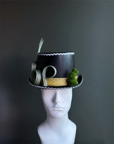 Whimsical mini top hats sold individually.