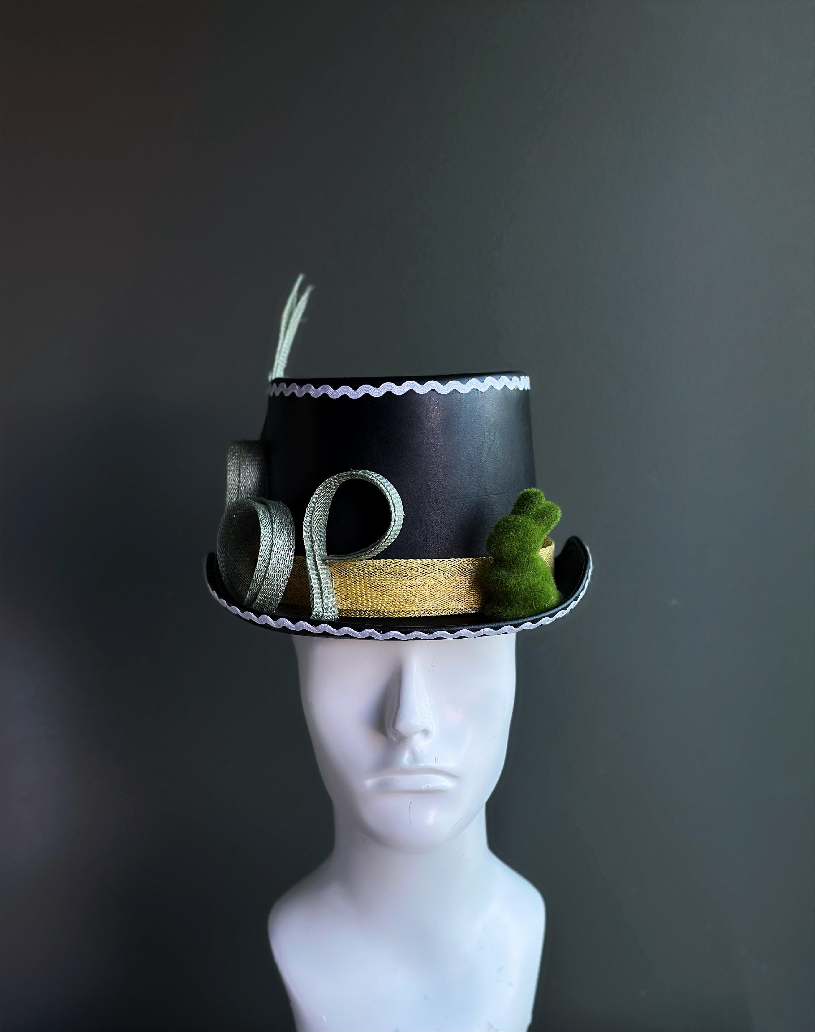 Whimsical mini top hats sold individually.