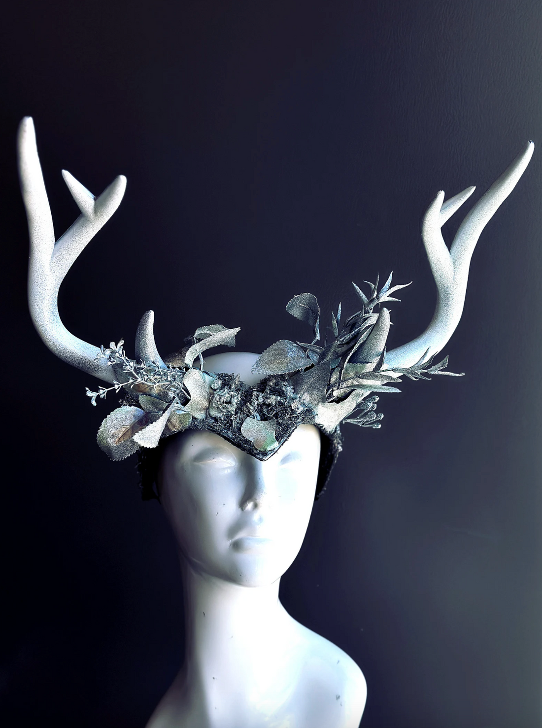 Fantasy crown with white antlers and icy silver floral accents for costume or cosplay