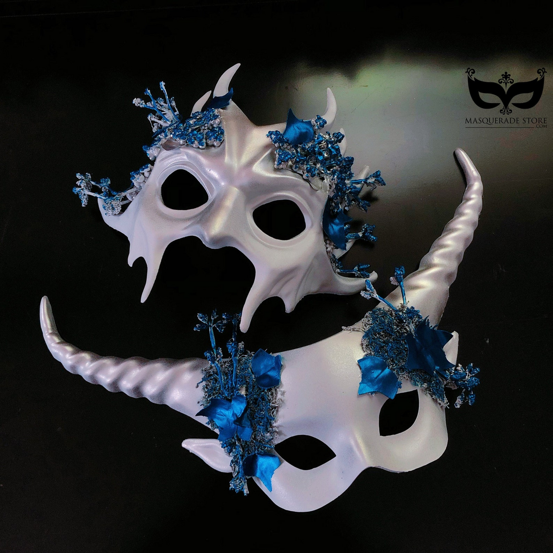 White masquerade couples mask set with sculpted horns and blue floral details, perfect for Venetian masquerade balls, Halloween, and fantasy festivals.