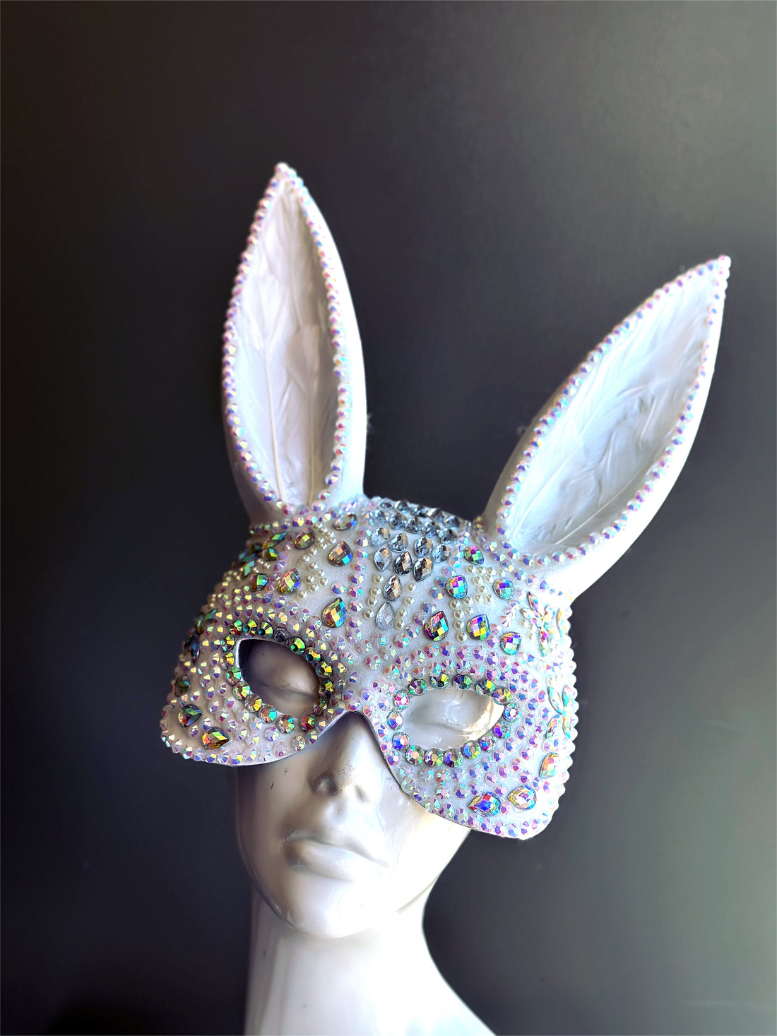 Sparkly white bunny ear masquerade mask with rhinestones and holographic gems, ideal for parties, raves, and masquerade balls.