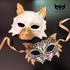 White and gold wolf masquerade mask paired with gold-trimmed lace mask for couples.
