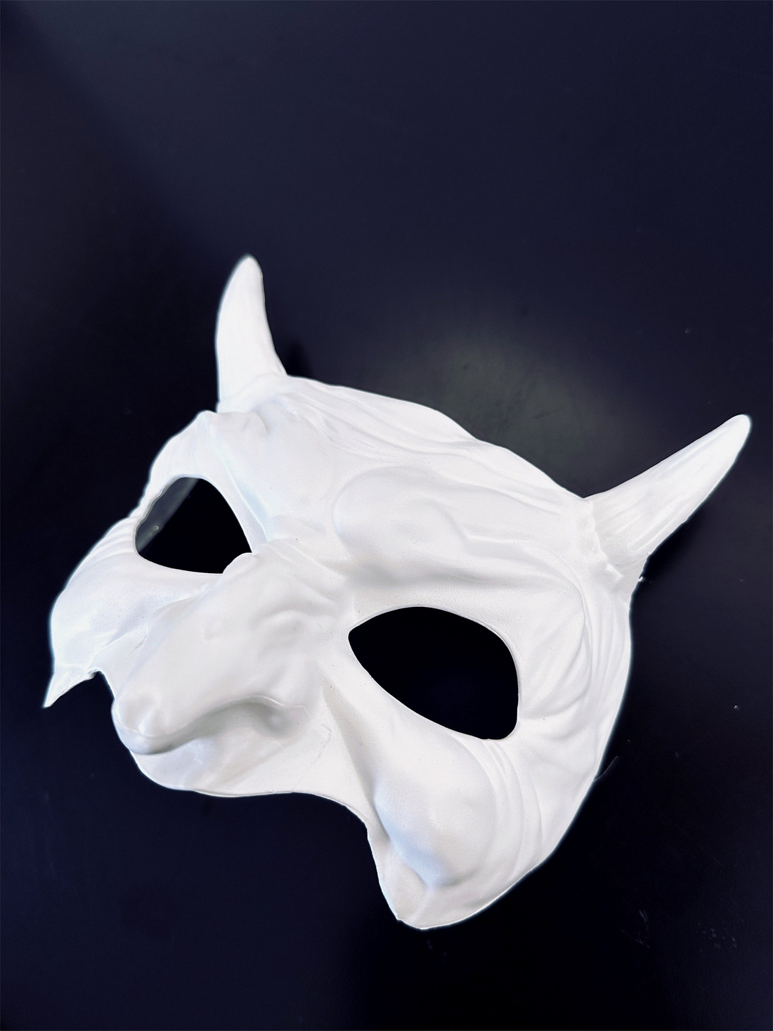 White Venetian masquerade mask with devil horns and long sculpted nose for Halloween, Carnival, cosplay, and gothic costumes.