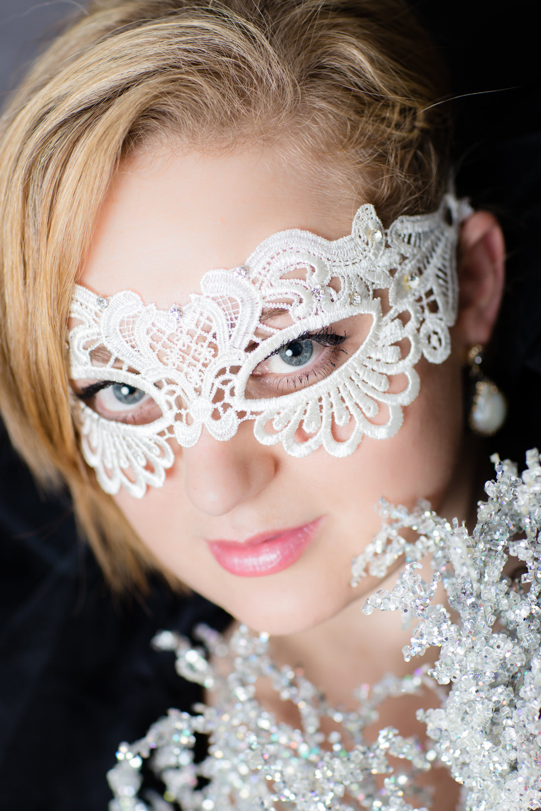 Bridal-style white lace masquerade mask with intricate detailing