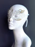 Delicate white lace mask with golden gear detailing, perfect for steampunk masquerade ball or bridal cosplay
