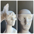 White masquerade couples mask set with lace feather pearl women’s mask and embossed swirl men’s mask.