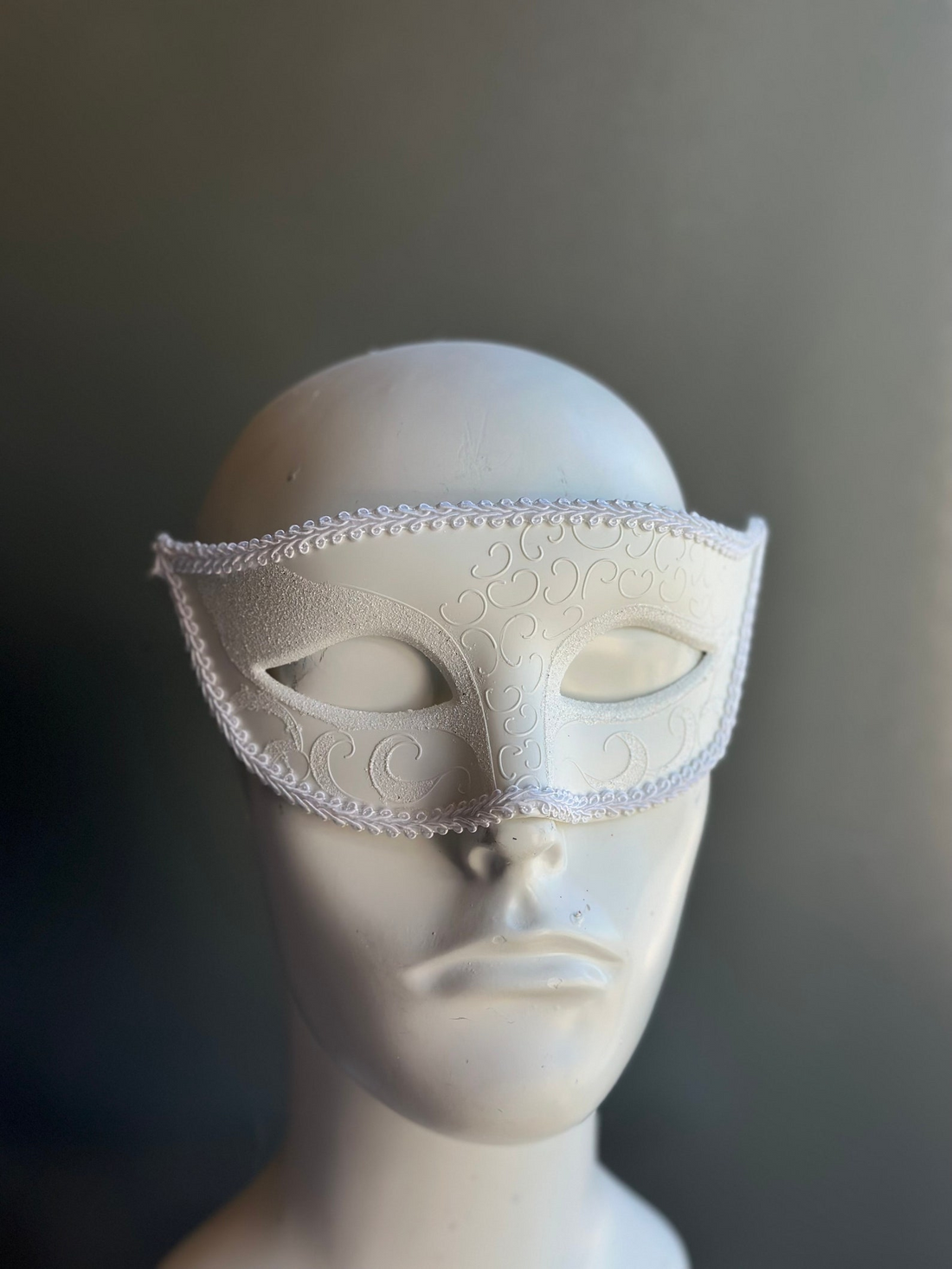 White masquerade mask embossed swirl men’s mask.
