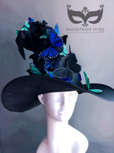 Whimsical black witch hat with bright butterfly accents in warm tones for Halloween or fantasy styling