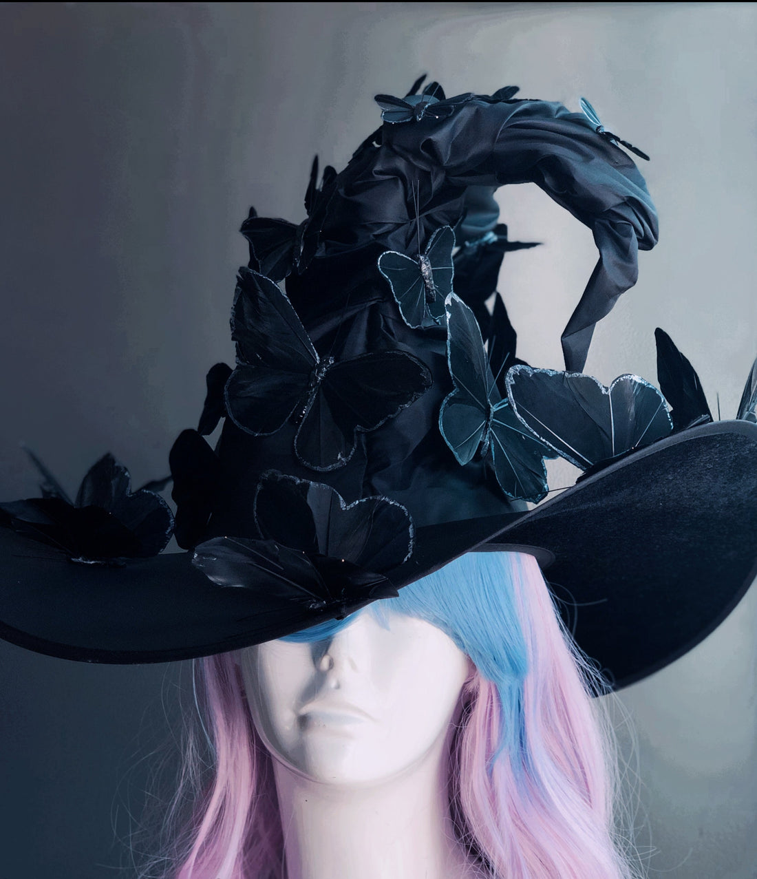 Black witch hat with black butterflies.