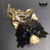 Black wolf masquerade mask with gold accents paired with a crystal-studded gold lace filigree mask for couples.