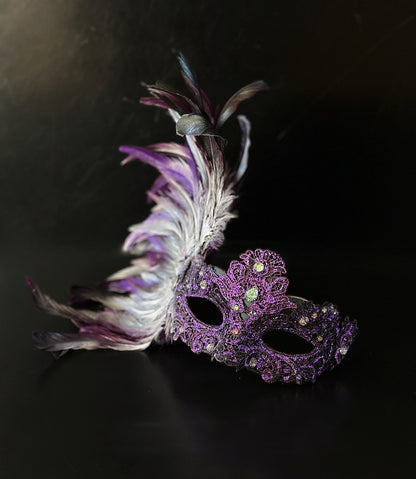 Purple feather masquerade mask with ornate resin half mask for formal masquerade occasions.