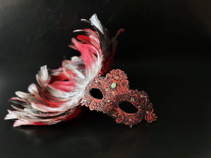 Red and black feather masquerade mask set with ornate resin half mask for formal gala occasions.