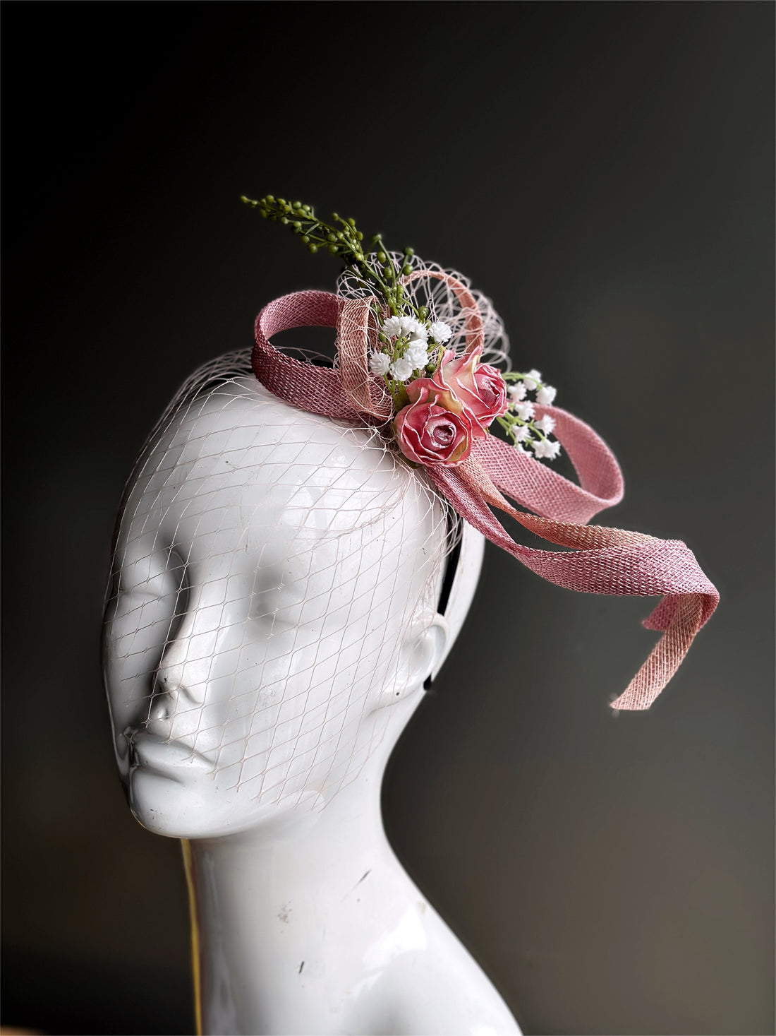 pink fascinator with flowers and pink netting