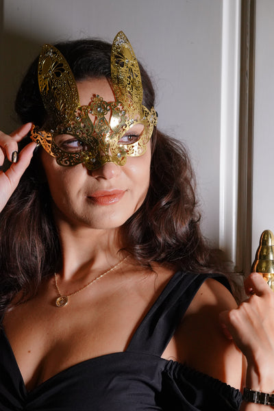 Women's bunny masquerade mask in gold laser cut metal.