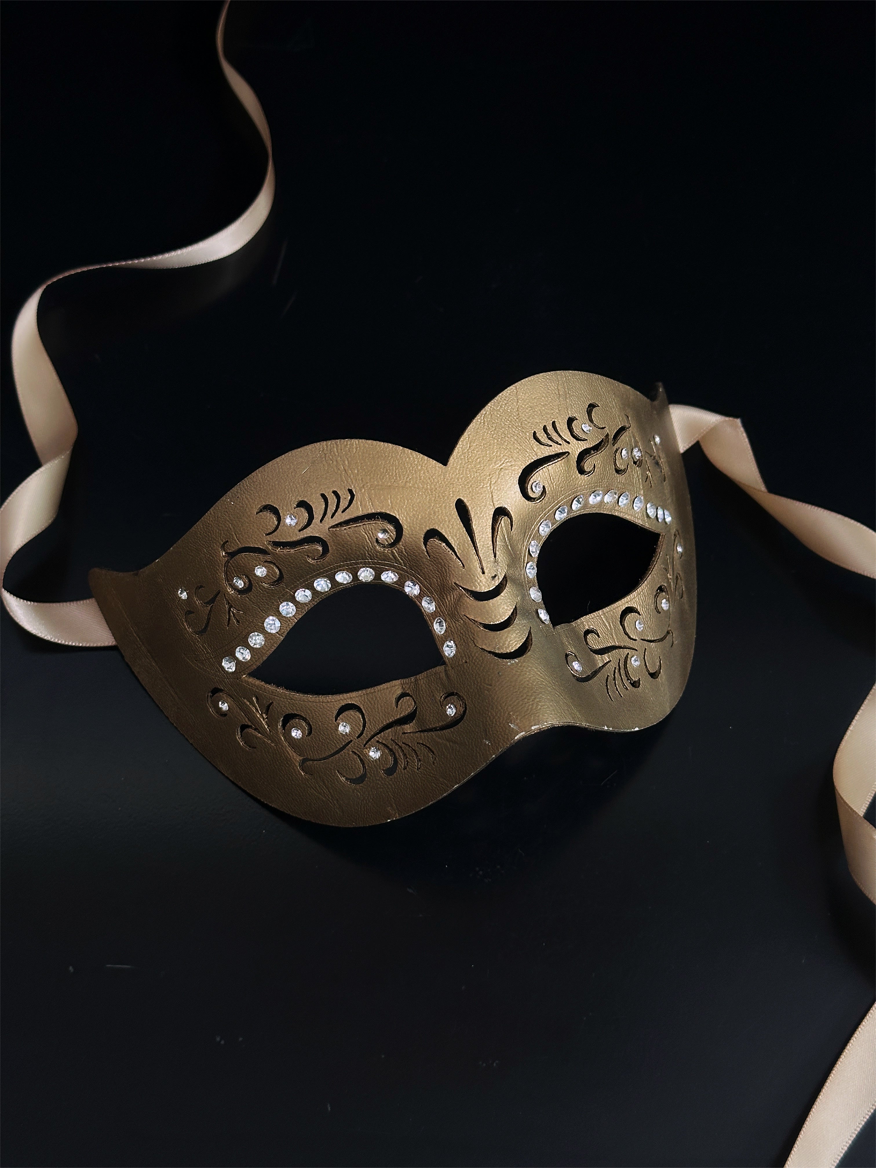 Womens masquerade mask in gold vegan leather with rhinestones.