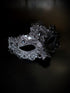 Womens masquerade mask in black with gems.