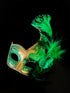 Womens masquerade mask in gold and green with green feathers.