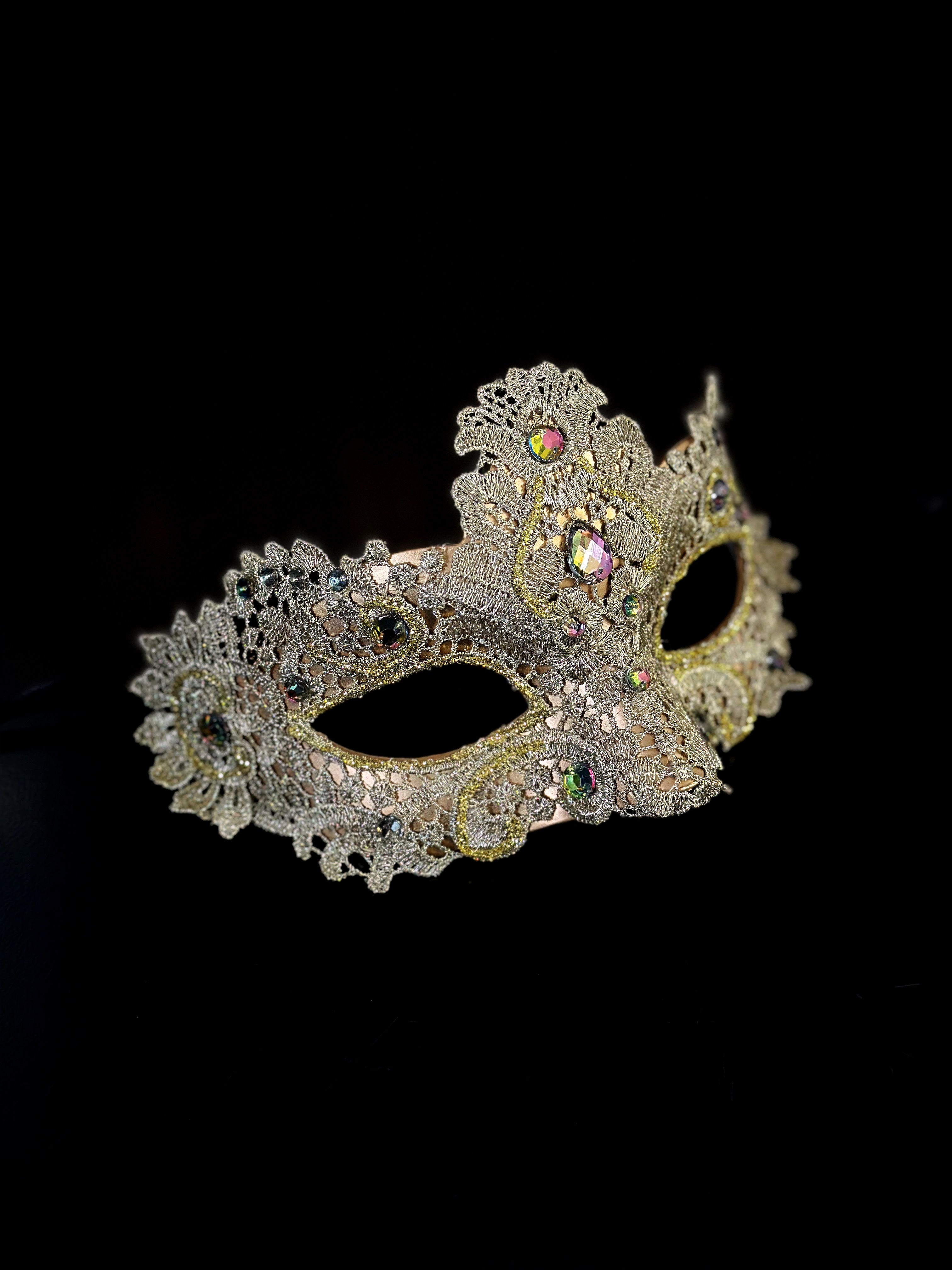 Womens lace brocade masquerade mask in gold with gems.