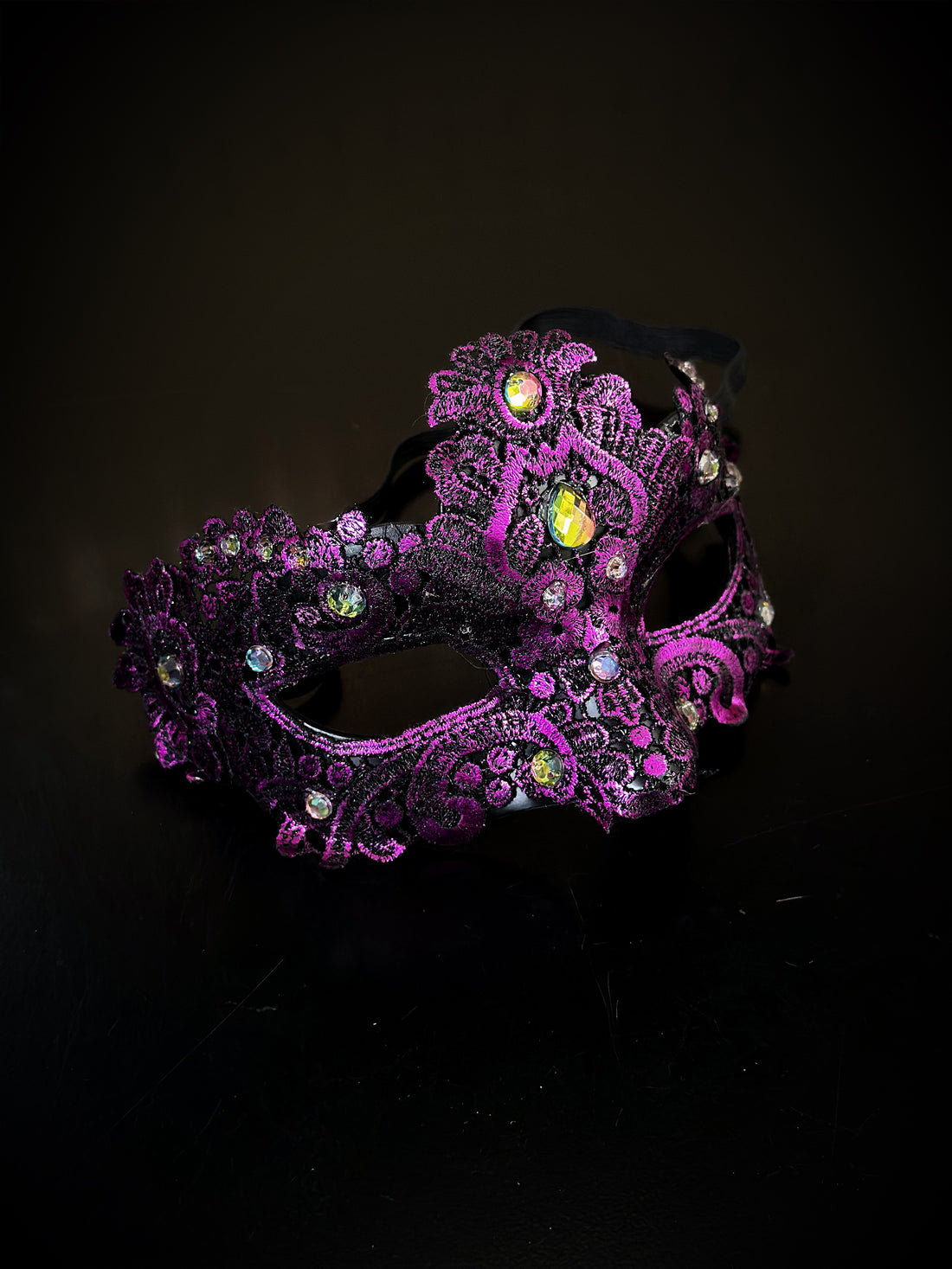 Womens brocade lace masquerade mask in purple with gems.