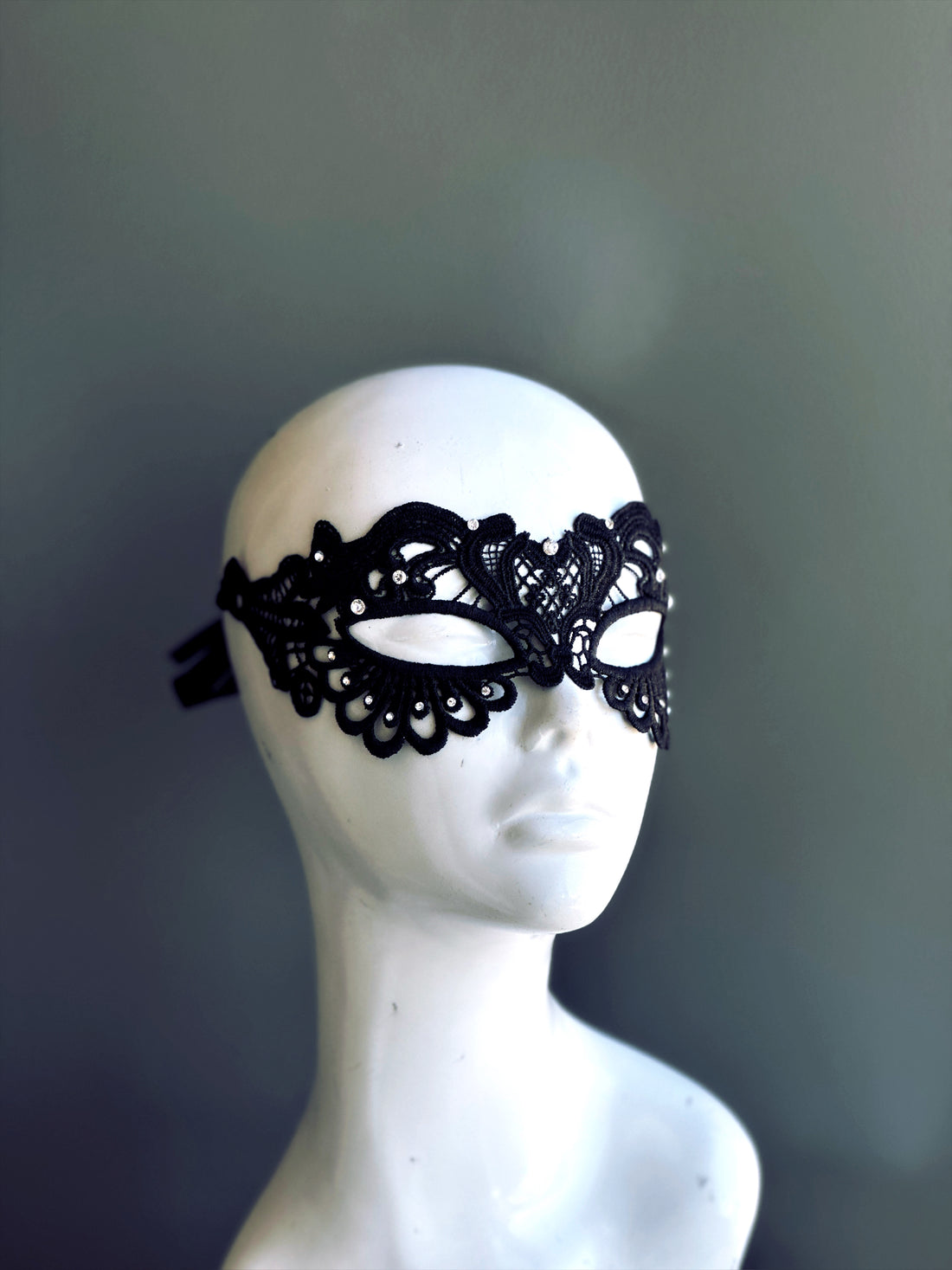 Womens lace masquerade mask with rhinestones in black.