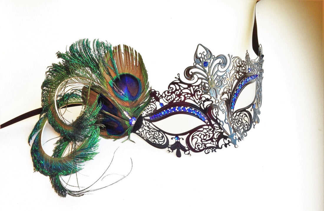 Womens black metal mask with peacock feathers and blue sapphire rhinestones.