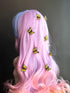 Bright yellow butterfly clips in pastel wavy hair for whimsical styling