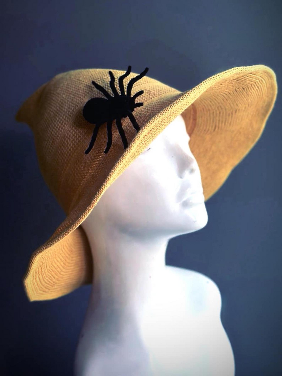 Yellow witch hat with black spider accent, perfect for Halloween, gothic, or masquerade costumes.