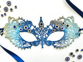 Blue ombre embroidered lace Venetian masquerade eye mask featuring sapphire blue rhinestones and satin ribbon ties. Perfect for masquerade balls, Mardi Gras celebrations, weddings, black tie galas, proms, cosplay, Renaissance festivals, opera performances, Halloween parties, and formal costume events.