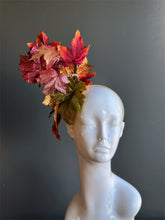 Autumn leaf fascinator hat with glittered red and gold leaves for fall.