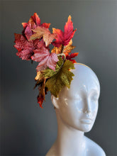 Autumn leaf fascinator hat with glittered red and gold leaves for fall.