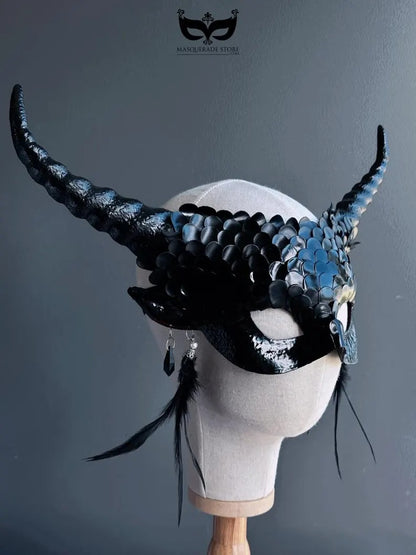 Fantasy black dragon masquerade mask with curled horns and feathers.