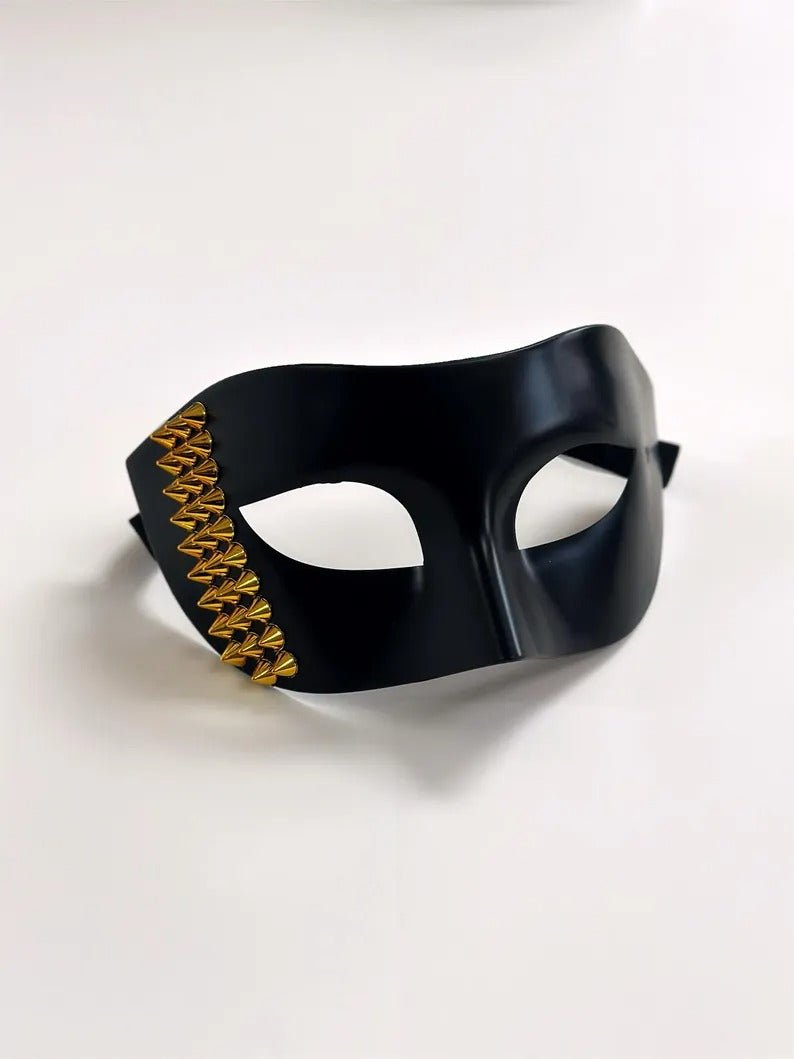 Black Venetian masquerade mask with bold gold stud accents, men’s edgy half-face party mask.