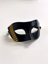 Black Venetian masquerade mask with bold gold stud accents, men’s edgy half-face party mask.