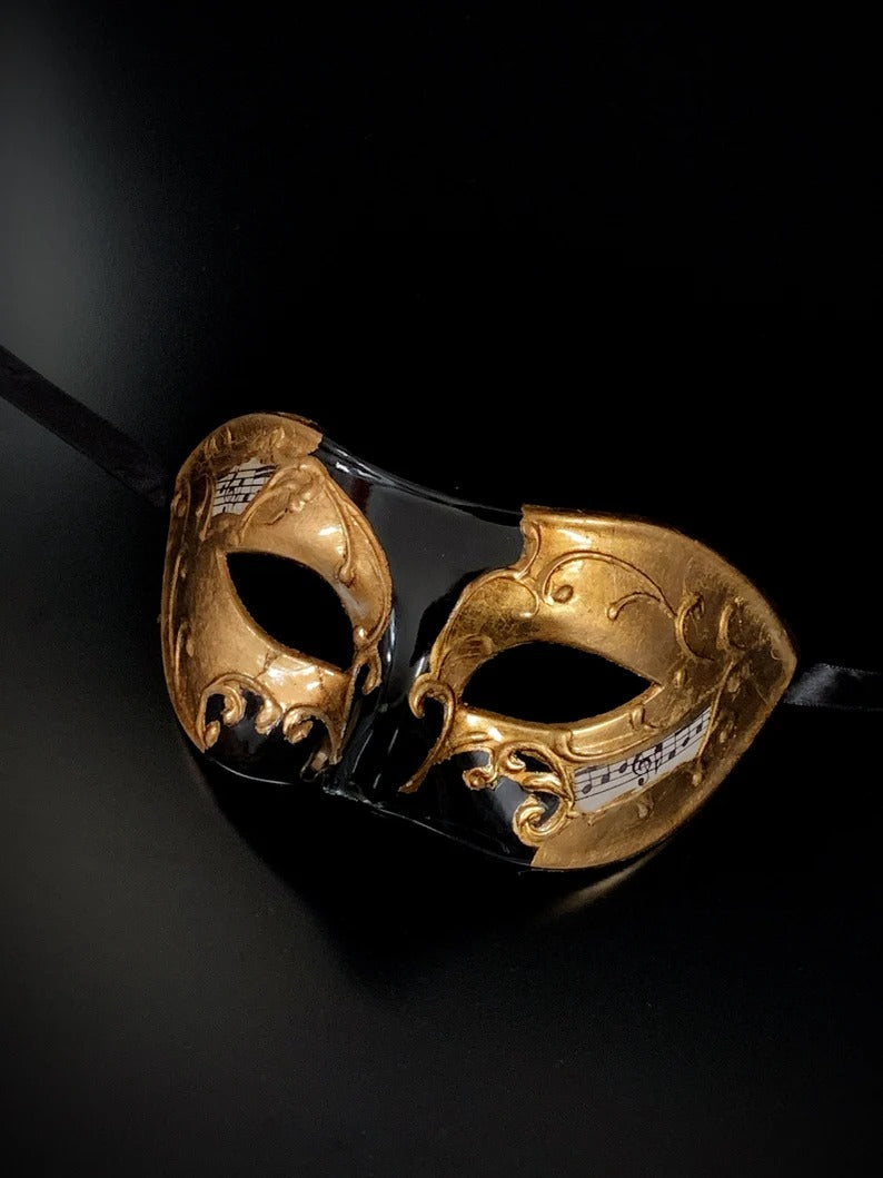Black and gold Venetian masquerade mask with music notes for men’s opera, Carnival, and masquerade costumes.