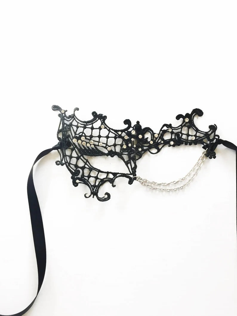 Black lace spiderweb masquerade mask with rhinestones and silver chains, gothic Halloween eye mask for women, perfect for costume parties and masquerade balls.