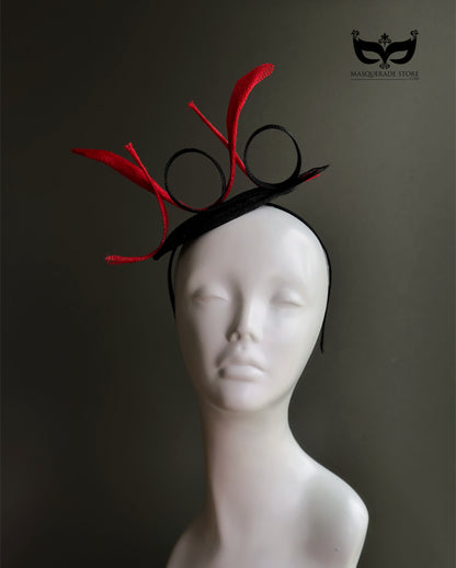 Black fascinator hat with red sculpted loops
