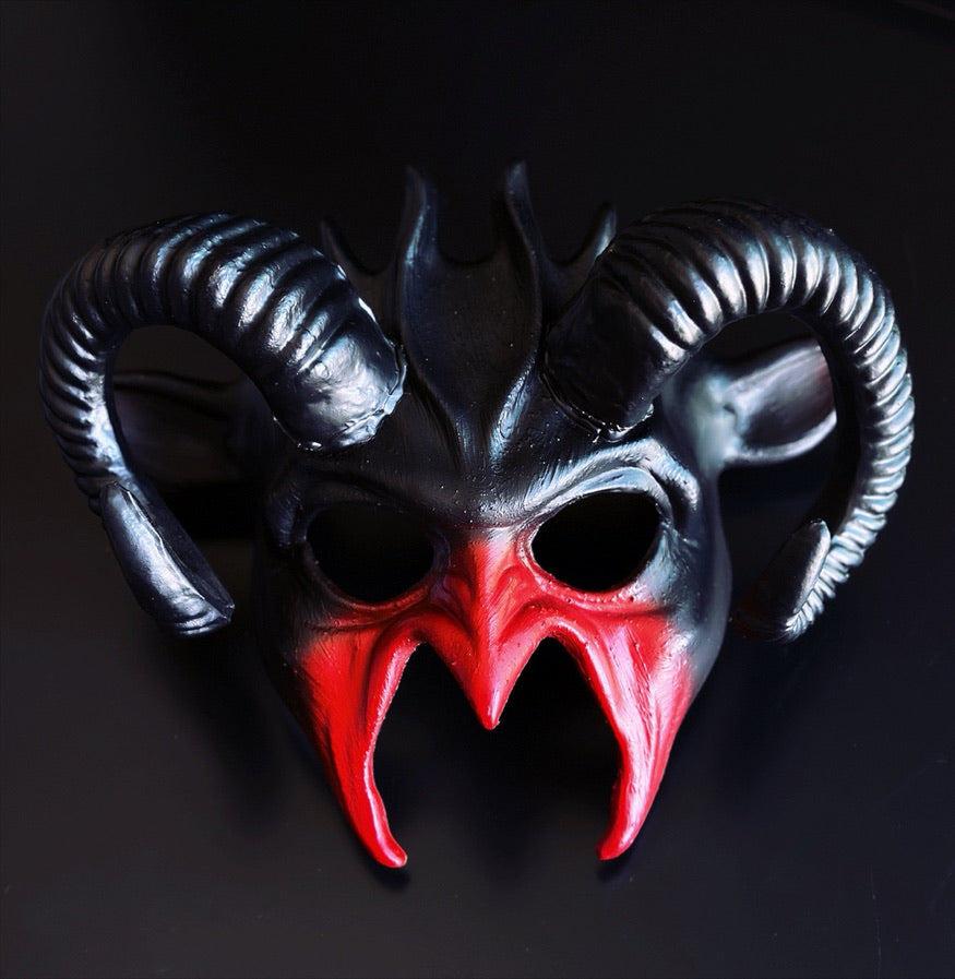Black and red ram horn fantasy masquerade mask with sculpted devil-inspired face, curved horns, and lightweight polyresin construction for Halloween, cosplay, gothic events, masquerade balls, theatrical productions, and fantasy-themed parties.