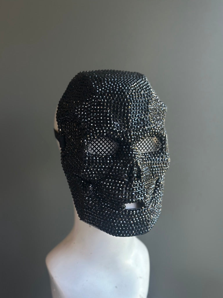 Black rhinestone-encrusted skull mask with a full-face design, ideal for gothic masquerades, Halloween, and statement costume wear.