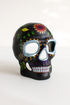 Black sugar skull masquerade mask with floral details.