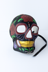 Black sugar skull mask with red roses and gold teeth.