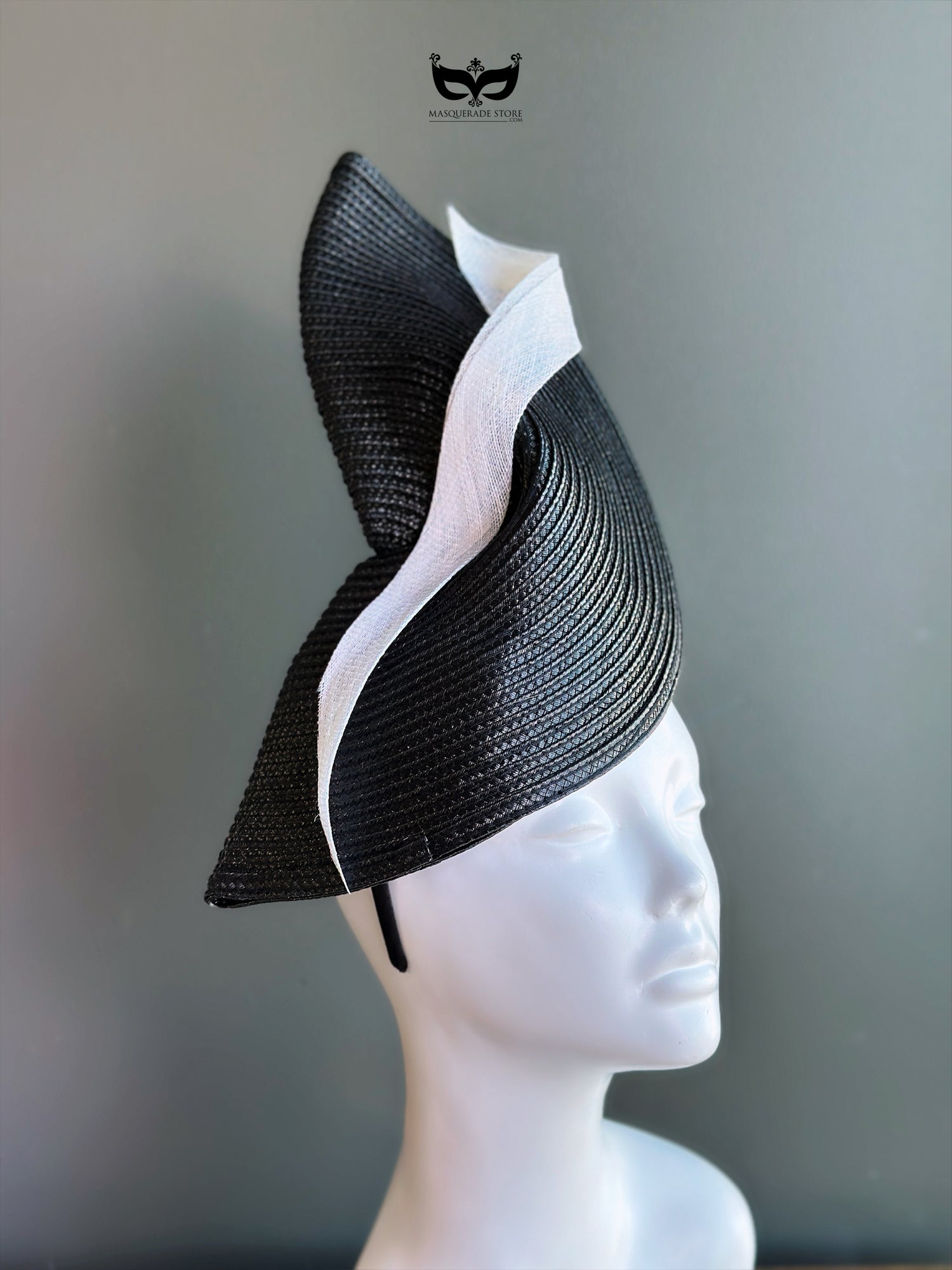 Black and white sculpted fascinator hat for weddings, derby races, and formal events.